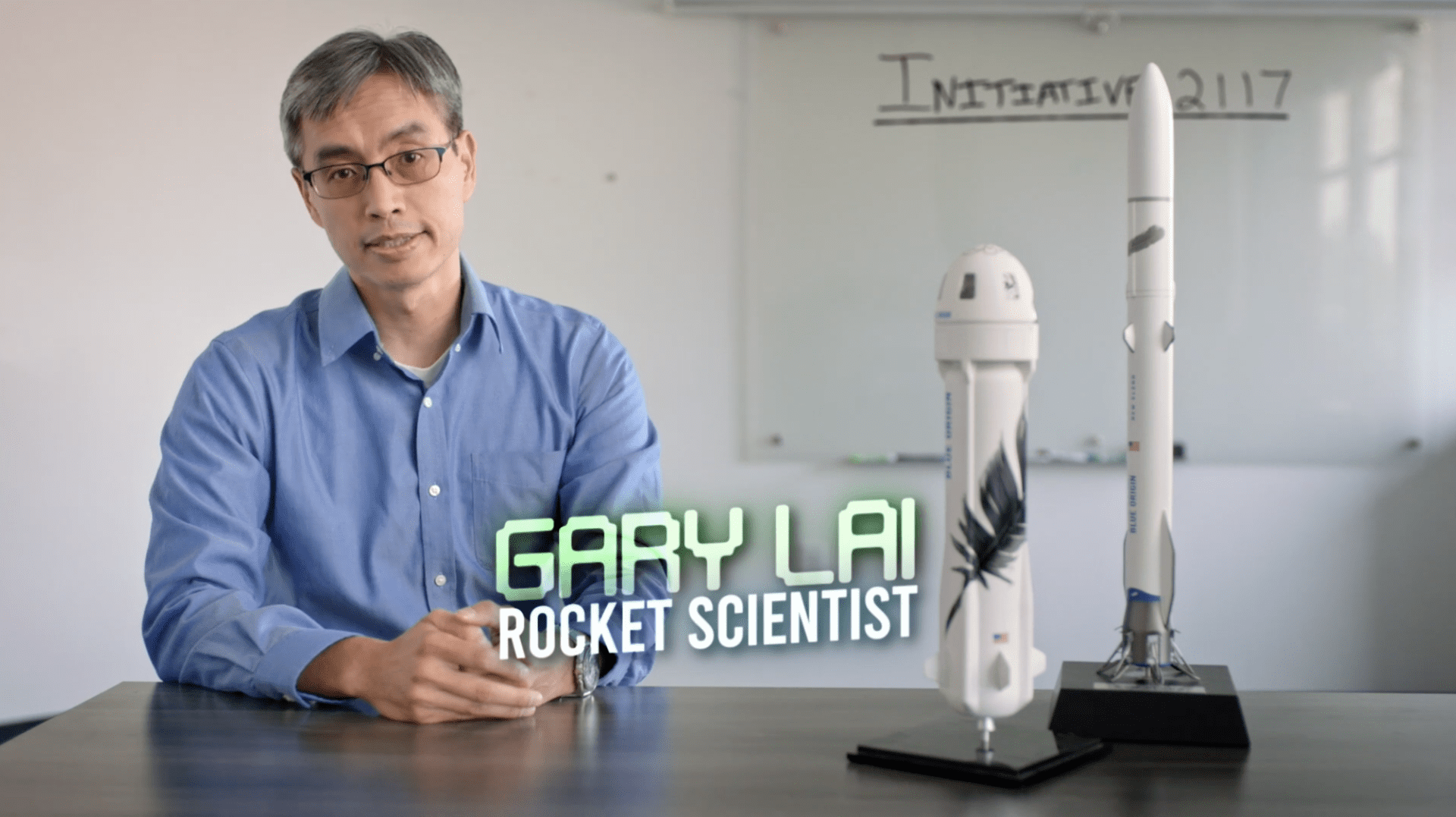 Gary Lai, a rocket scientist, sits at a desk